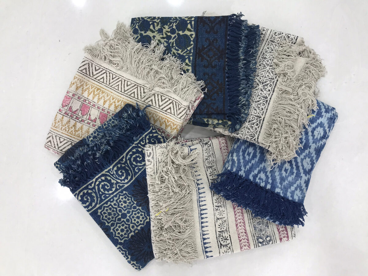 Folded printed and woven rugs and durries